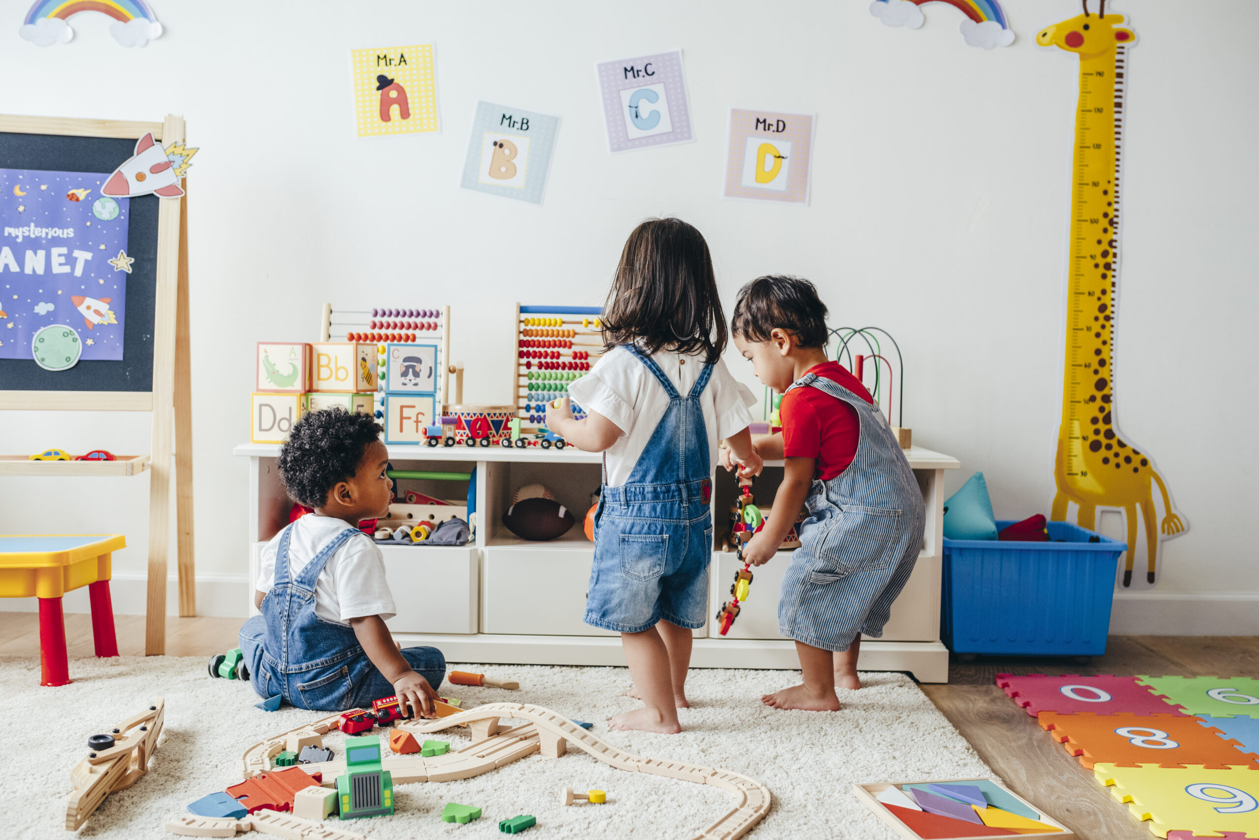 Children playing with toys in a playroom