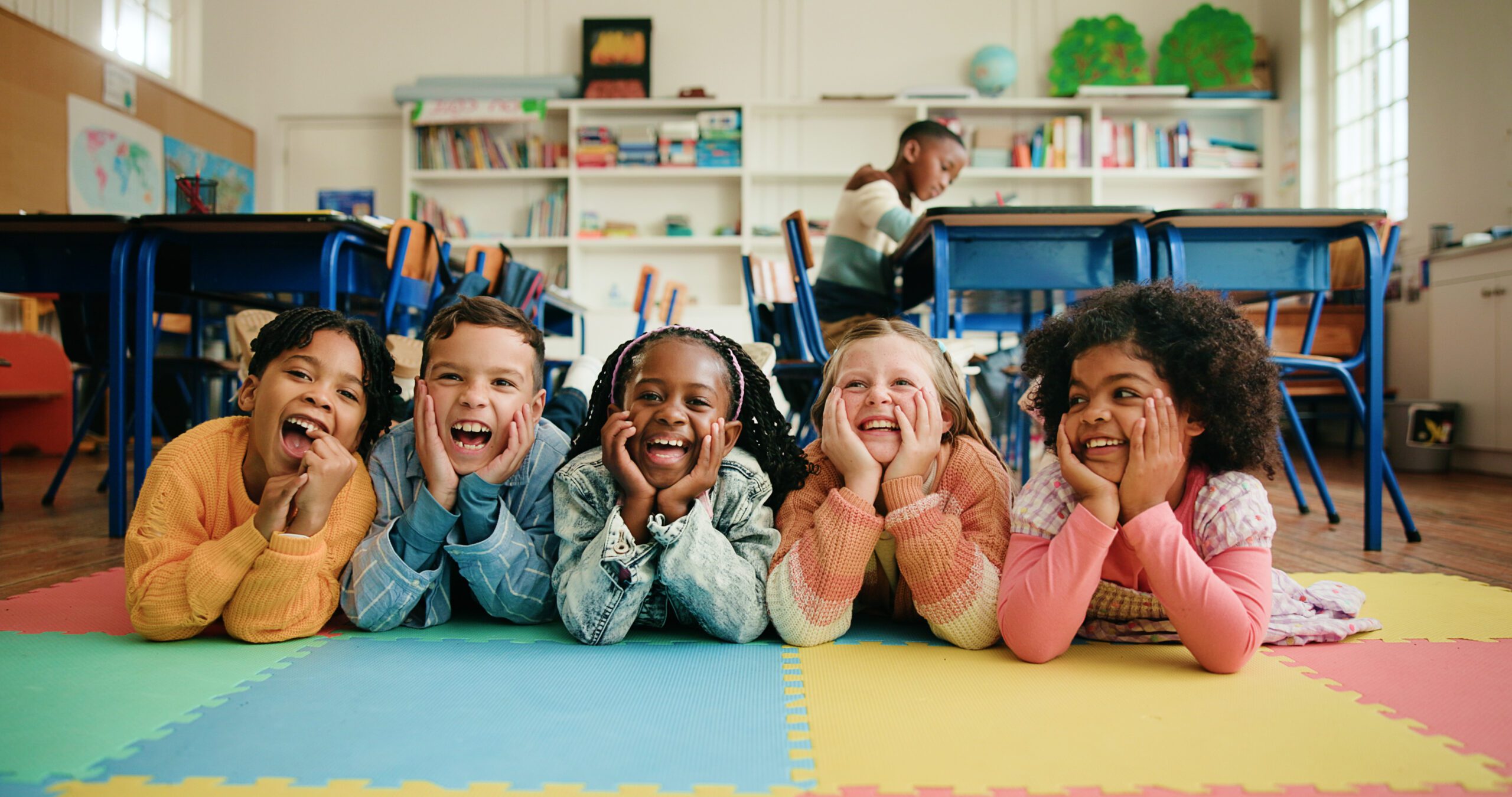 group-of-happy-children-laughing-together-on-a-cla-2026-05-25-16-14-11-utc (1) Children laughing together in a classroom
